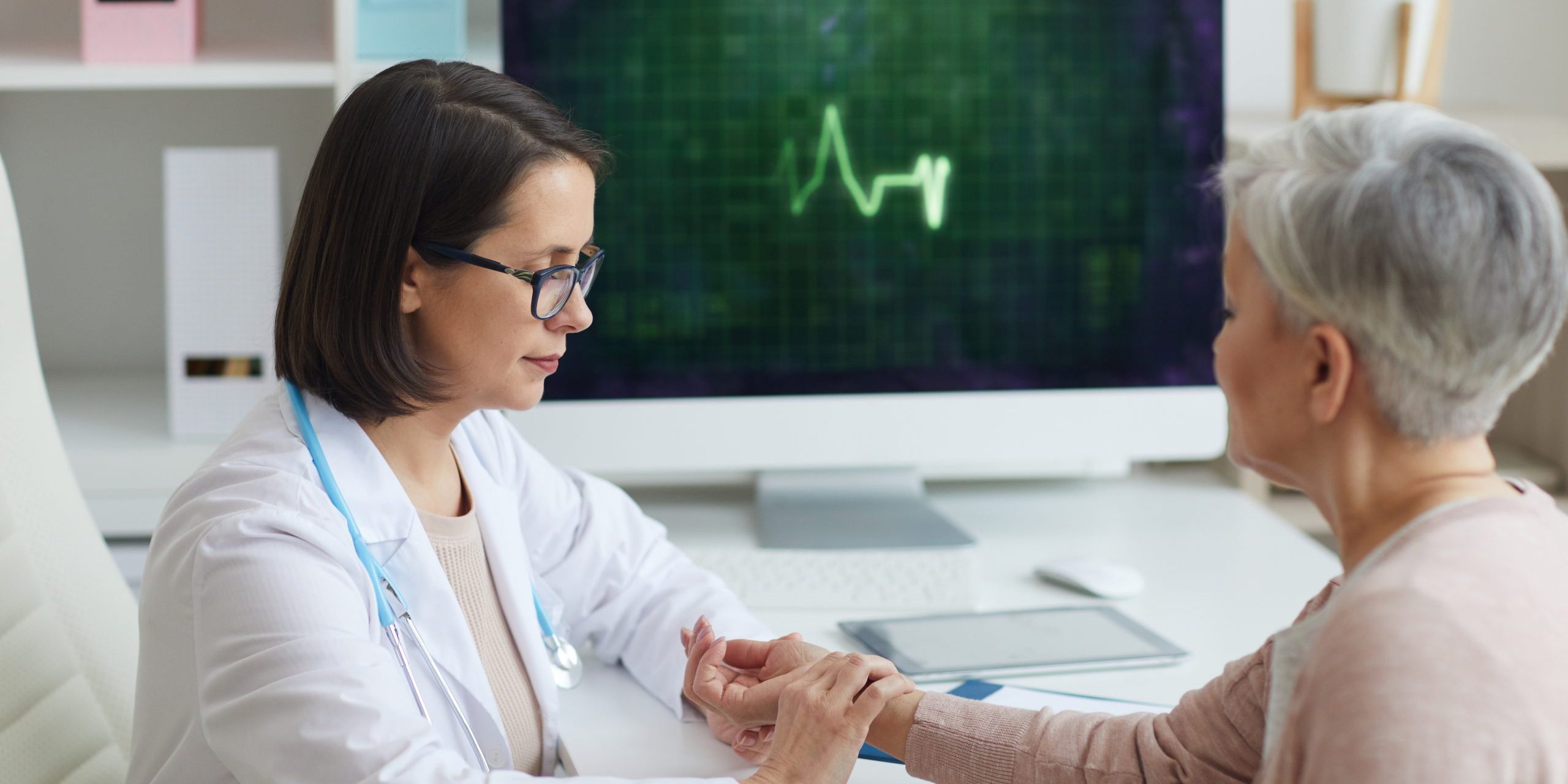Doctor Checking Heart Rate of Senior Patient