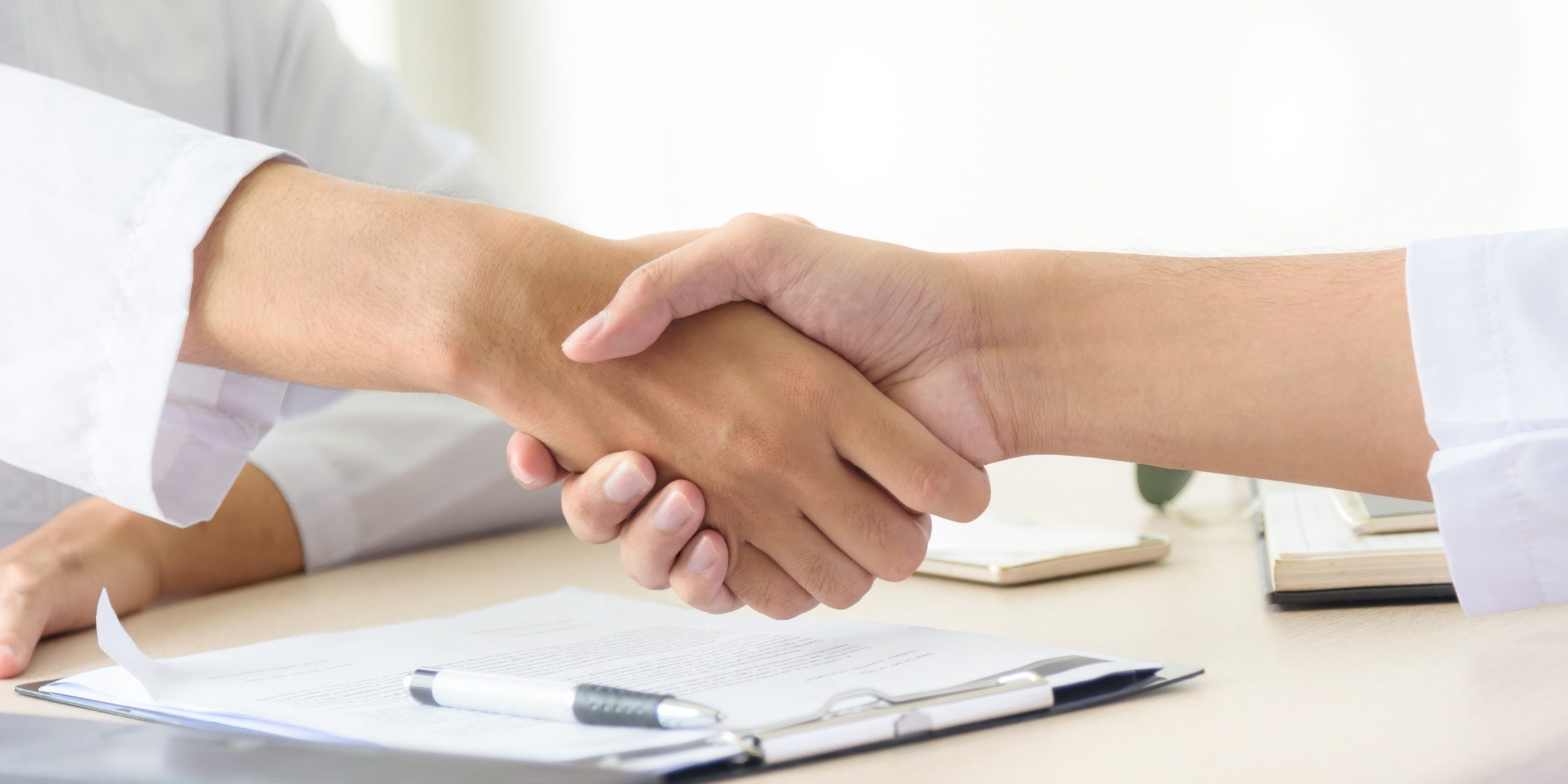 Business people shaking hands, partnership merger and acquisitio